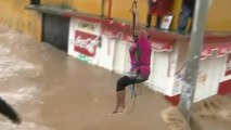 Locals forced to swim through Mexico's flooded streets