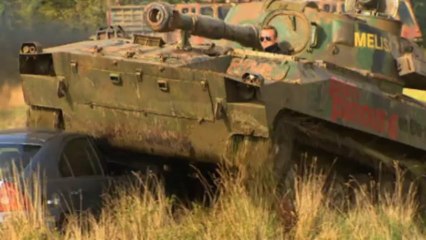 Hilarious reporter crushes cars in tank driving fail