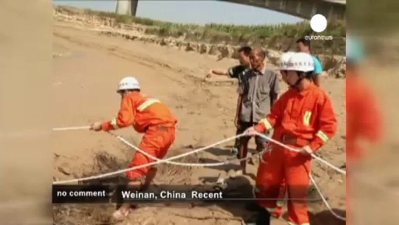 Chinese woman rescued from mud - no comment