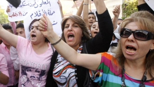 Syrian students rally for Assad while NATO upholds military option