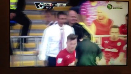 Football player Craig Bellamy pours water over the referee