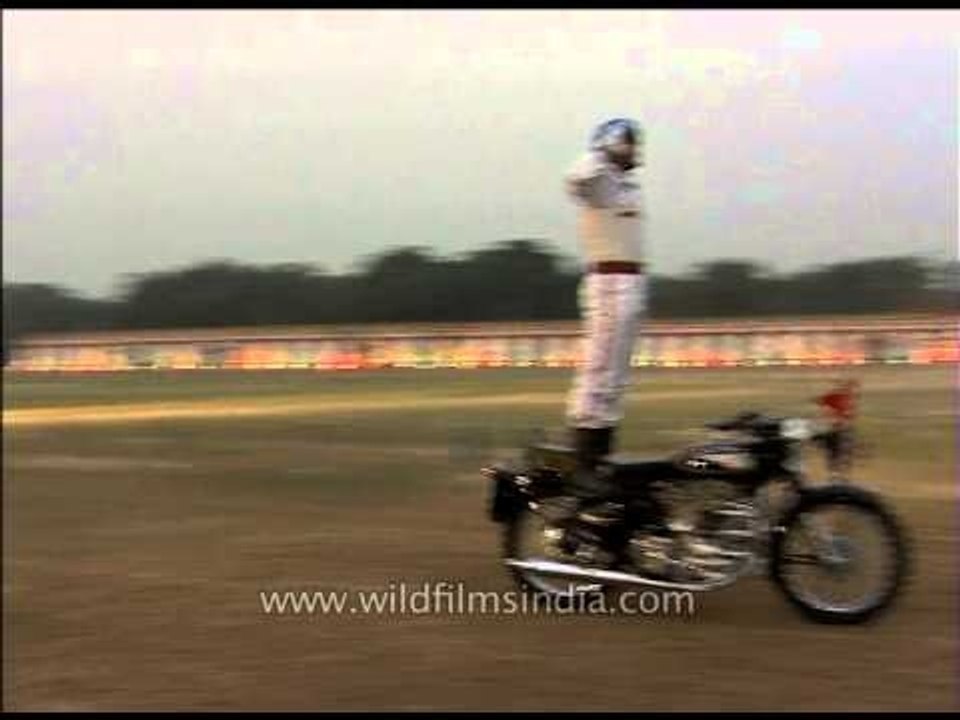 The BSF personnel rode the bikes down the ground standing, sitting opposite, reading newspaper