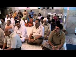 People engrossed in Krishna bhajan in Rock satsang