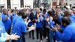 Apple fans rush to buy new iPhones after long wait