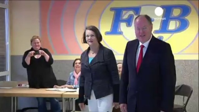 Merkel casts her vote as Germans go to polls in national...