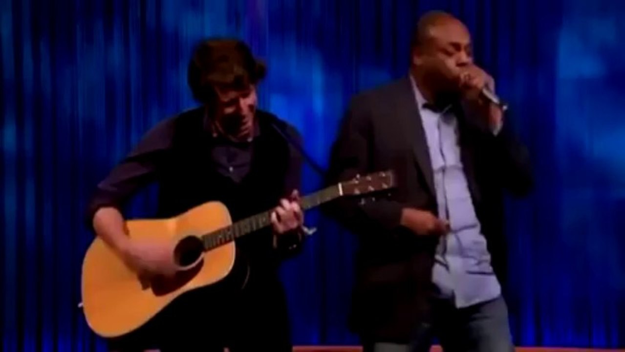 This Guy has a Guitar in his Mouth