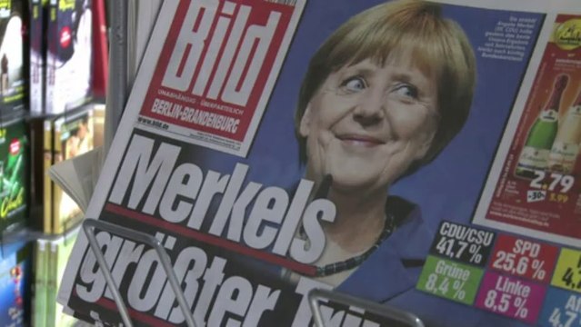 Triumphant Merkel says 'open' to tie-up with rivals