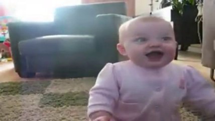 Baby laughing at dog eating popcorn