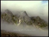 Shivling peeks out from behind the clouds, from Bhojwas