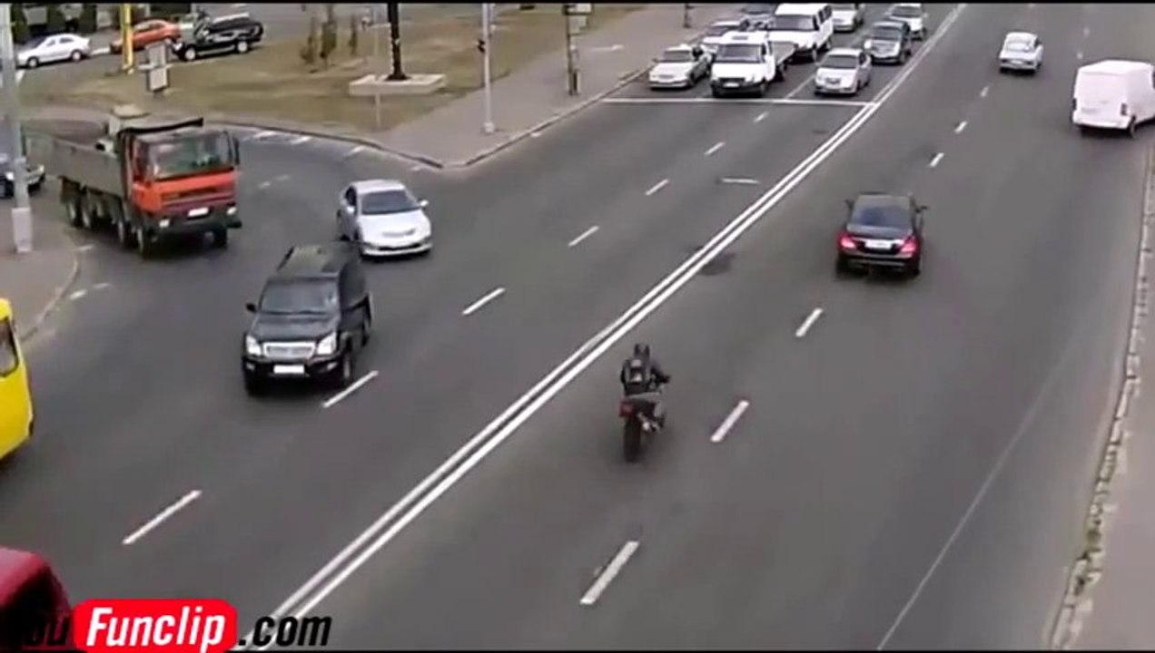 Motorbiker crashes into a Russian car!