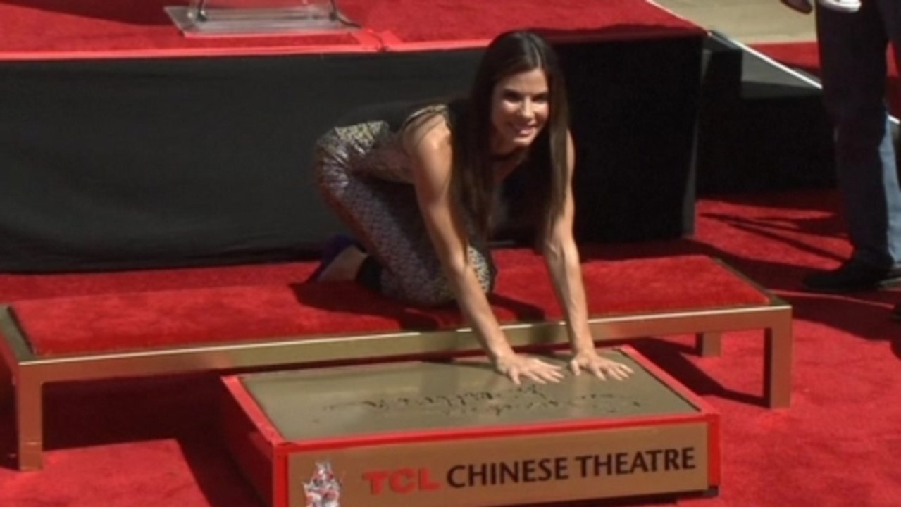 Bullock gets hand and footprint ceremony, closing arguments continue for Jackson's trial