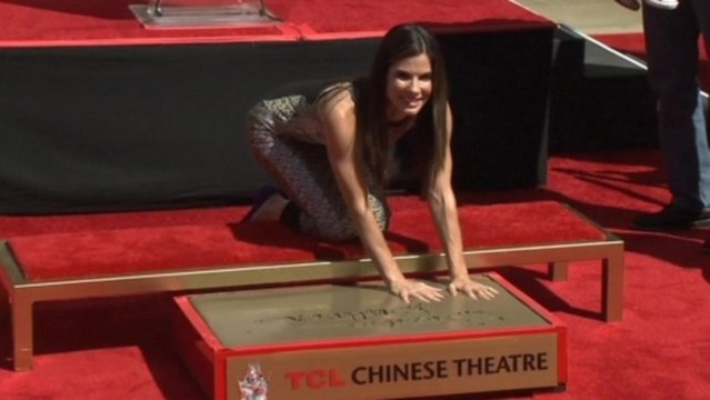 Bullock gets hand and footprint ceremony, closing arguments continue for Jackson's trial