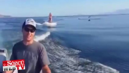 Yunuslarla su kayağı yaptılar