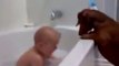 A baby and 2 dogs. Bath time fun. Super cute!