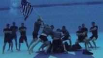 Navy Swim Team Pays Tribute to War Memorial
