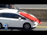 Surfboard decapitation? Flying surfboard nearly hits Honolulu driver