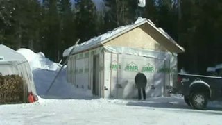 Guy Knocked Over by Snow Thrown From Roof