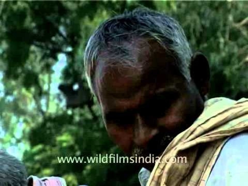 Old Indian man smoking a cigarette