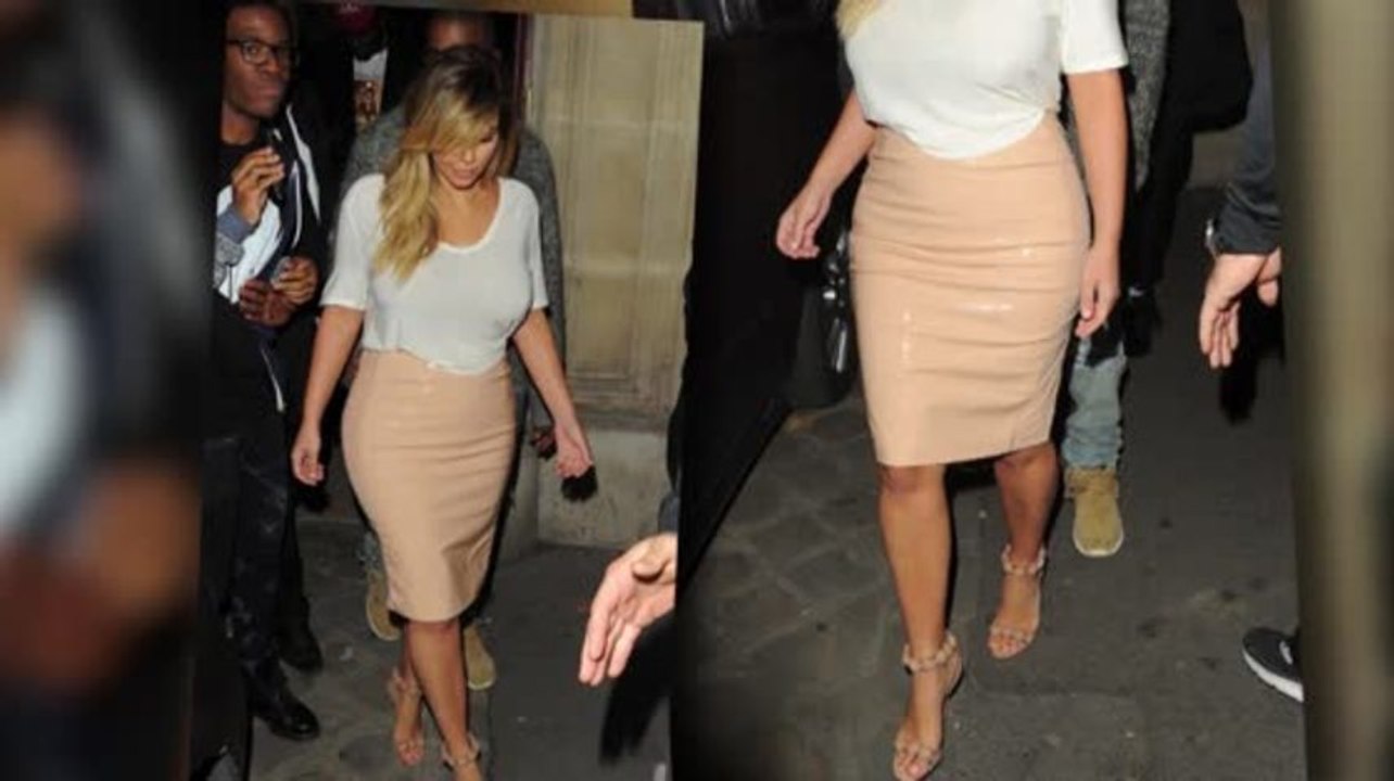 Kim Kardashian zeigt ihre schlanke Taille in einem beigen Bleistiftrock