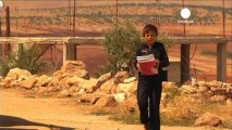Syrian kids back to school in Idlib province with...