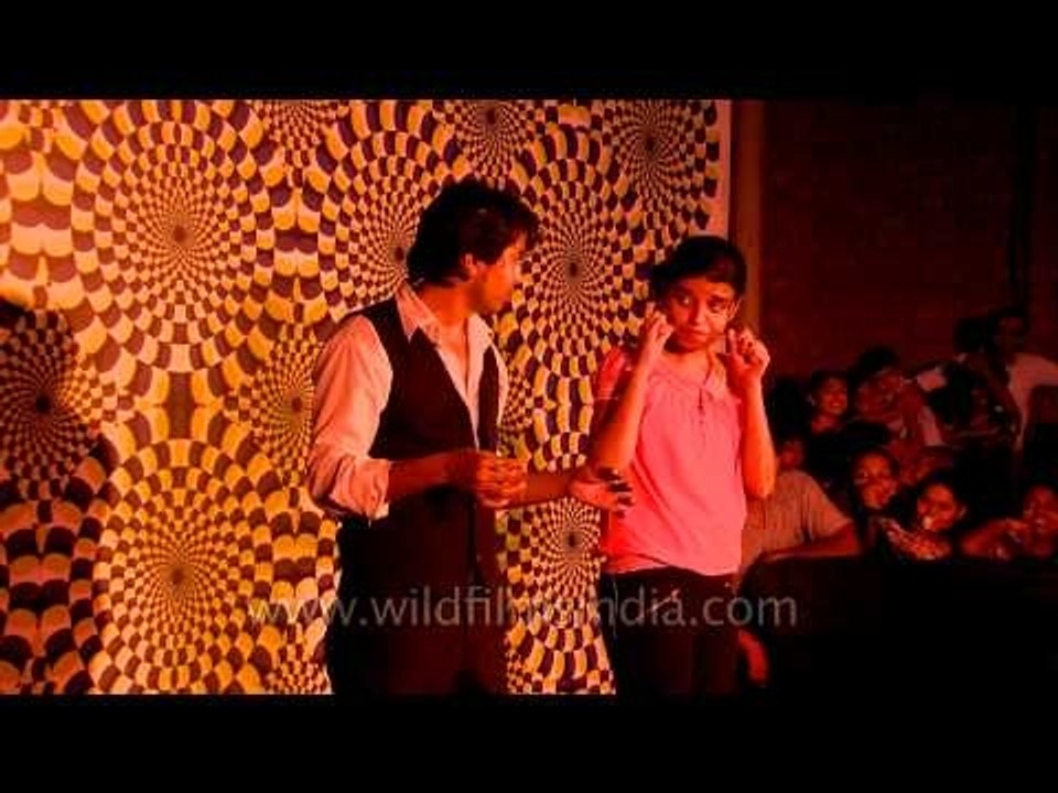 Magician displaying a variety of magic tricks :at Annual Magic Fest.