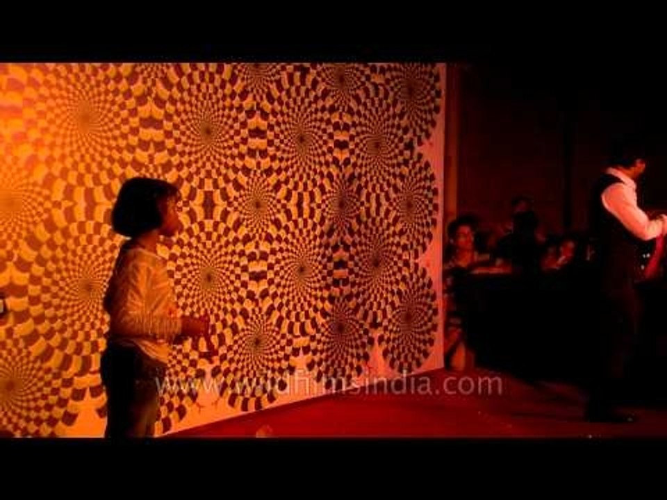 Magician performing tricks : at Dilli Haat Magic Fest