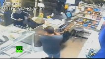 CCTV: Store clerk with machete prevents gun robbery