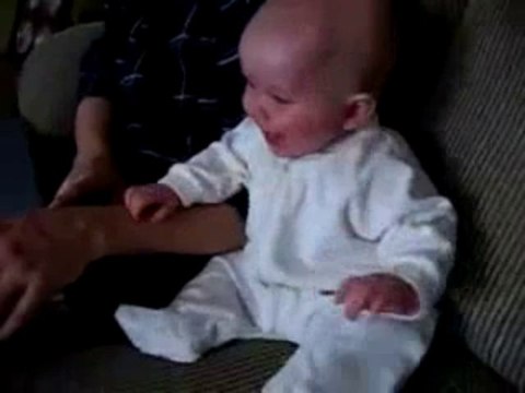 6 month old baby laughing at dog