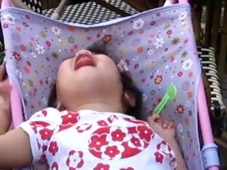 baby given a sour lemon