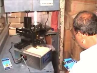 ELECTRO MECHANICAL BATCH CODING MACHINE.