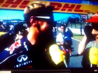 Sebastian Vettel messing with Niki Laudas cap.
