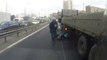 A biker almost smashed by a truck...