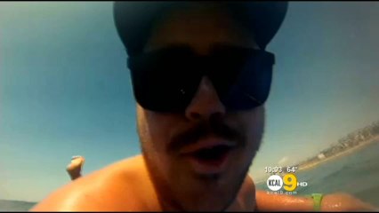 Southern California surfer close with a shark