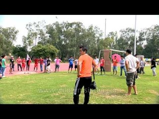 Making an attempt in shot put at Naga Fest'13-Delhi