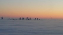 Aerial View Captures Skyscrapers Amid Fog in Warsaw