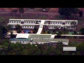 Australia launches inquiry into detention center escape