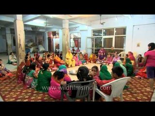 An old woman narrating the story of Karva Chauth