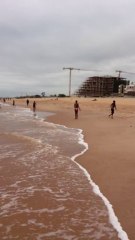 Boys dancing on the beach