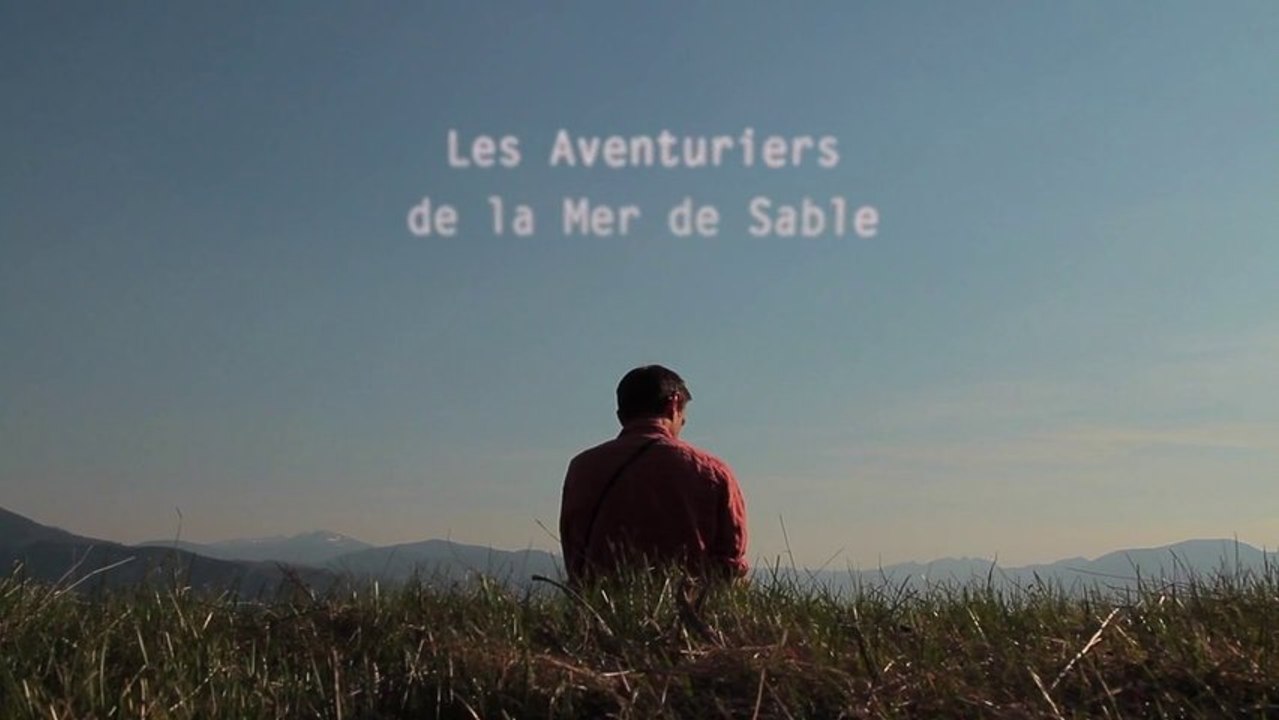 Sand artist making off "Mer de sable"