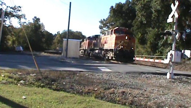 BNSF power leads NS 737 coal train SB through Mableton Ga.