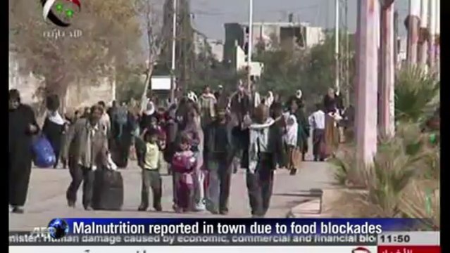 Syrian civilians evacuate war-battered Damascus suburb