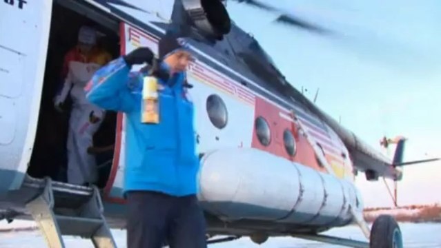 Olympic torch takes a trip to the tundra to meet reindeers