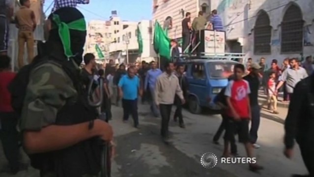 Palestinians hold funeral for militant killed in Israeli tank fire