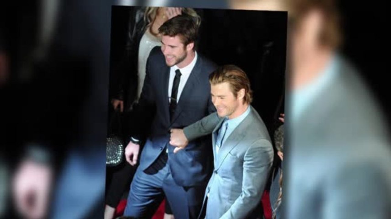 Chris Hemsworth Jokingly Pushes Brother Liam at Thor Premiere