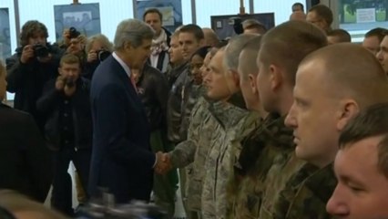 Kerry visits Polish air base ahead of U.S. defense bid