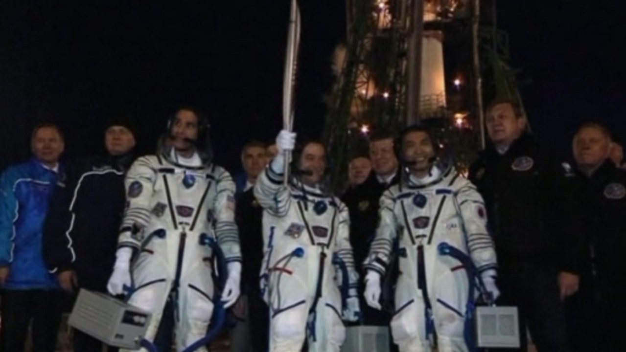 Olympic torch reaches ISS