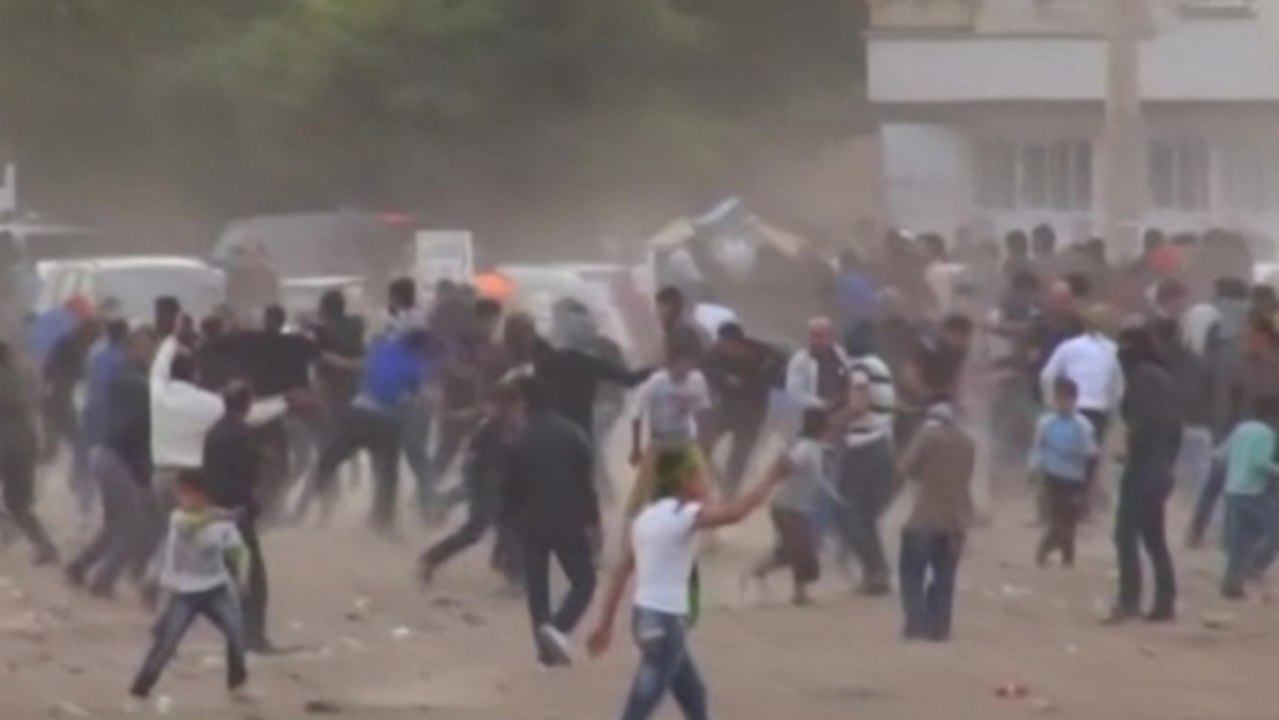 Turkish police fire tear gas as Kurds protest Syrian wall