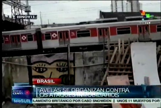 Habitantes de favela Moinho derriban muro de la vergüenza