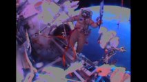 Cosmonauts take Sochi Olympic torch on spacewalk
