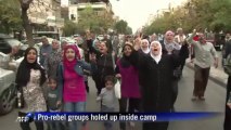 Aid convoy reaches Yarmuk refugee camp in Damascus